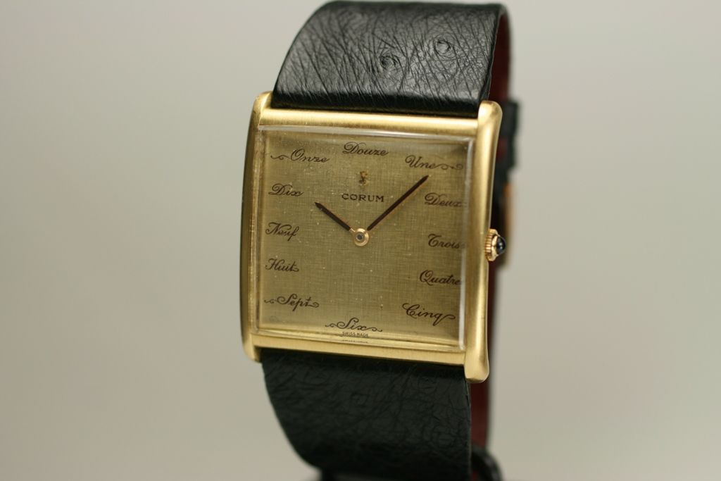 This is a vintage Corum Buckingham 18K Gold Watch from the 1970s,it features a unique dial.
