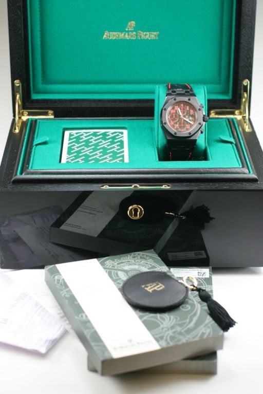 The designers at Audemars Piguet designed this over the top watch and watch box, complete with a deck of cards. The case of this Audemars Piguet Royal Oak Offshore is a blackened steel, has the black dial with bright red Arabic numerals, chronograph