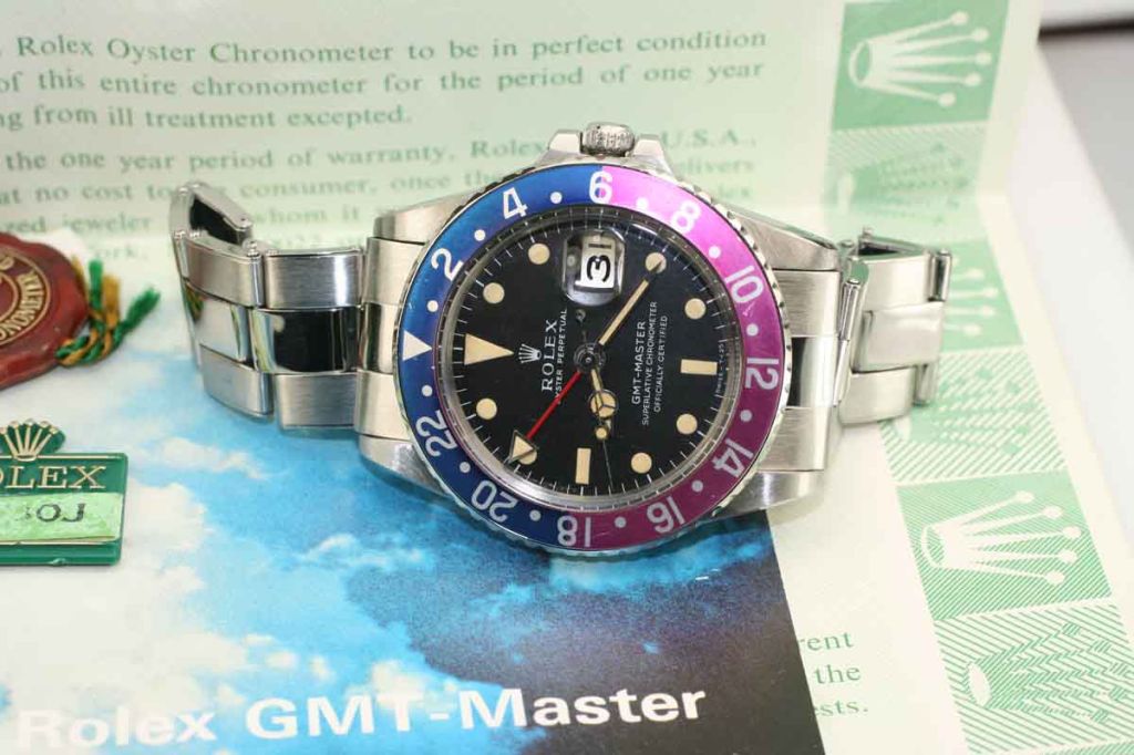 This is a Rolex GMT-Master reference 1675 with a blue/red aka 