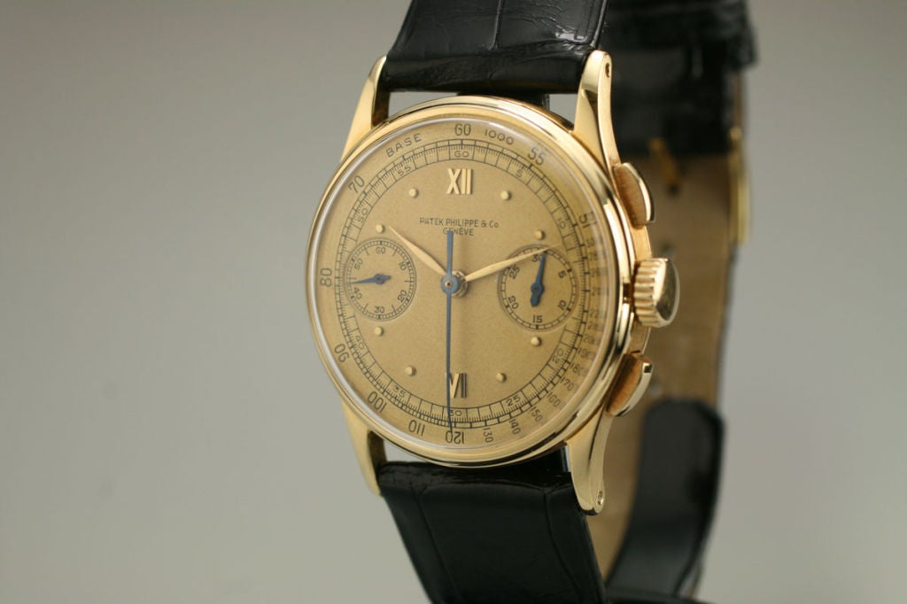 This is a beautiful example of a Patek Philippe chronograph, ref: 130, in 18k yellow gold from the 1940s.  The case, dial and movement are in excellent condition.  The dial has very a beautiful tan color with Roman numerals and dots.  The case has a