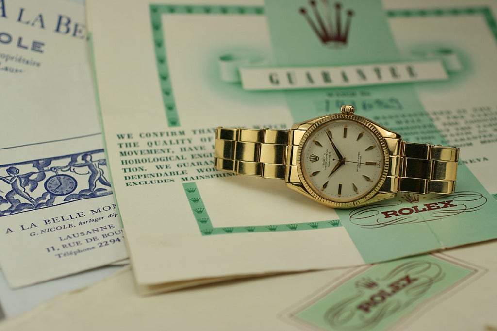 Rolex Oyster Perpetual reference 6567 in yellow gold with fluted bezel, ivory 