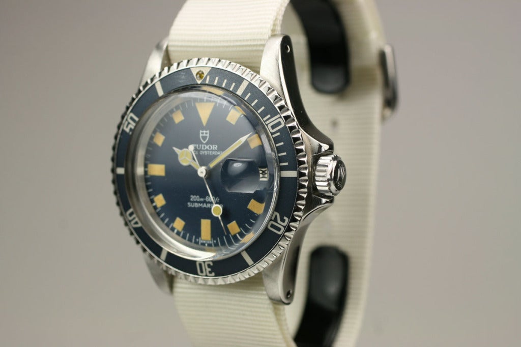 This is an excellent example of a stainless steel Tudor Submariner from the 1970s. The blue dial is in excellent condition with toned luminescent makers and the bezel has turned to a beautiful grey color. The Tudor Submariners have become quite