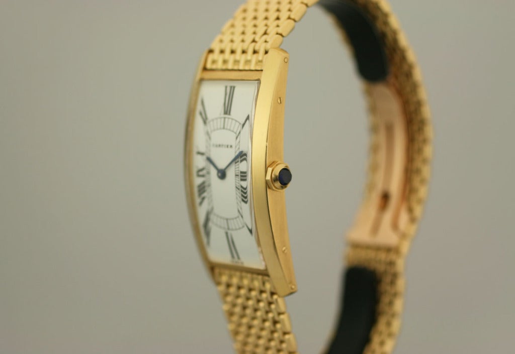 This is an original 18k Cartier Tank Cintree watch from the 1970s on an original “grains de riz” 18k Cartier band and deployant clasp. The 1970s version of this watch is quite rare as I have only seen a few for sale in the last 10 years. This