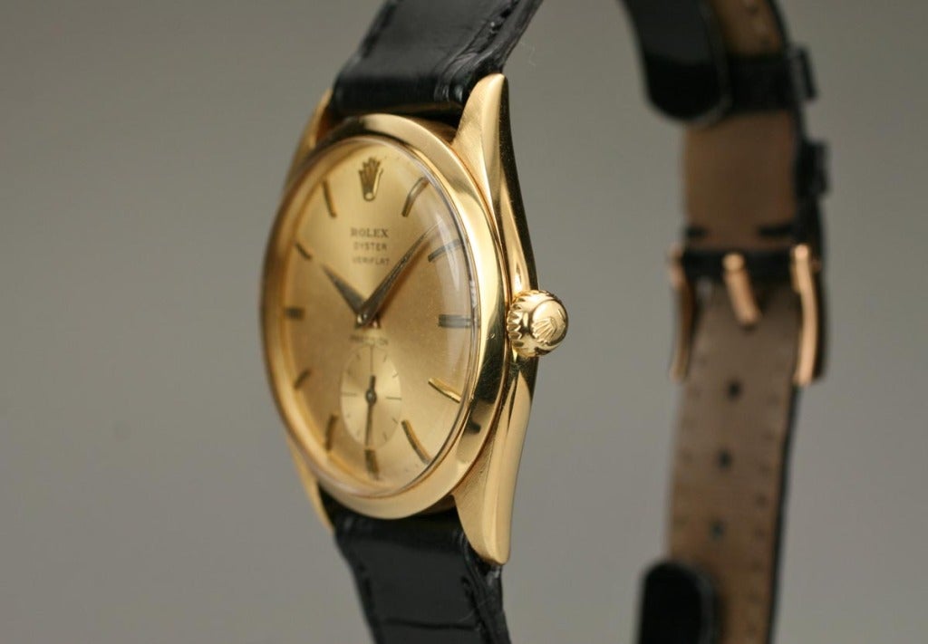 Rolex yellow gold Oyster Veriflat reference 6512 from the 1950s. This has a champagne dial, subsidiary seconds, dauphine hands, screw winding crown, and, as in the name, a very flat screw down case back.
