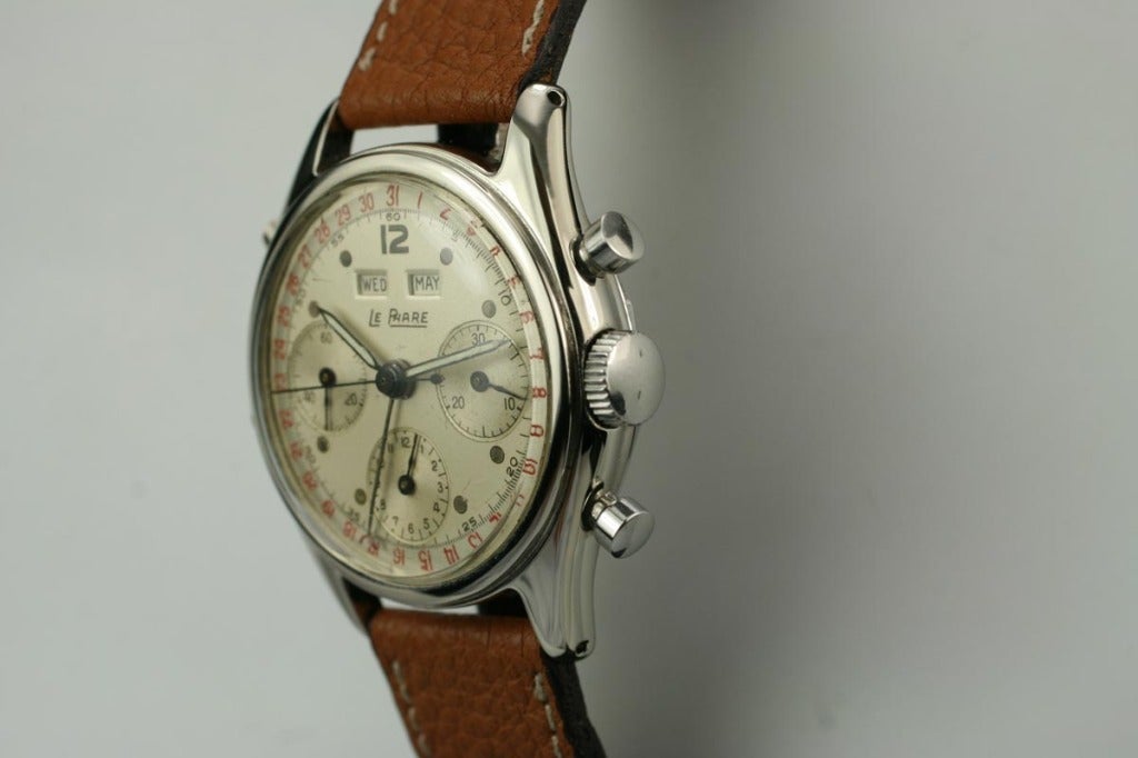 This is a beautiful Le Phare triple-date chronograph wristwatch from the 1950s. This is a beautiful example with a mint case and excellent original dial. Le Phare is not a household name but is a high quality Swiss watch with a dato-compax function.