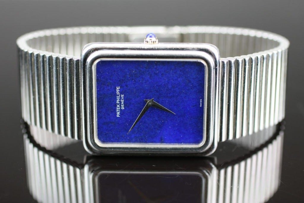 Patek Philippe reference 3649 with a white gold rectangular case, integrated bracelet, Lapis Lazuli dial and crown, with a manual wind movement. Total 7