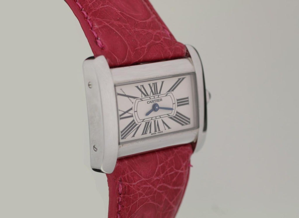 Cartier stainless steel Tank Divan with a Cartier pink strap and buckle. Comes with extra Cartier strap.