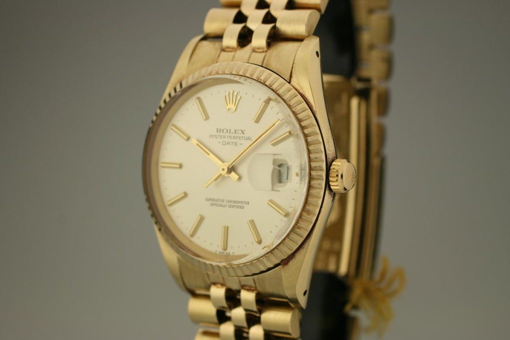 Rolex Date, Ref. 15037, with silvered dial, fluted bezel, jubilee bracelet, and comes complete with box, papers, and hang tag.