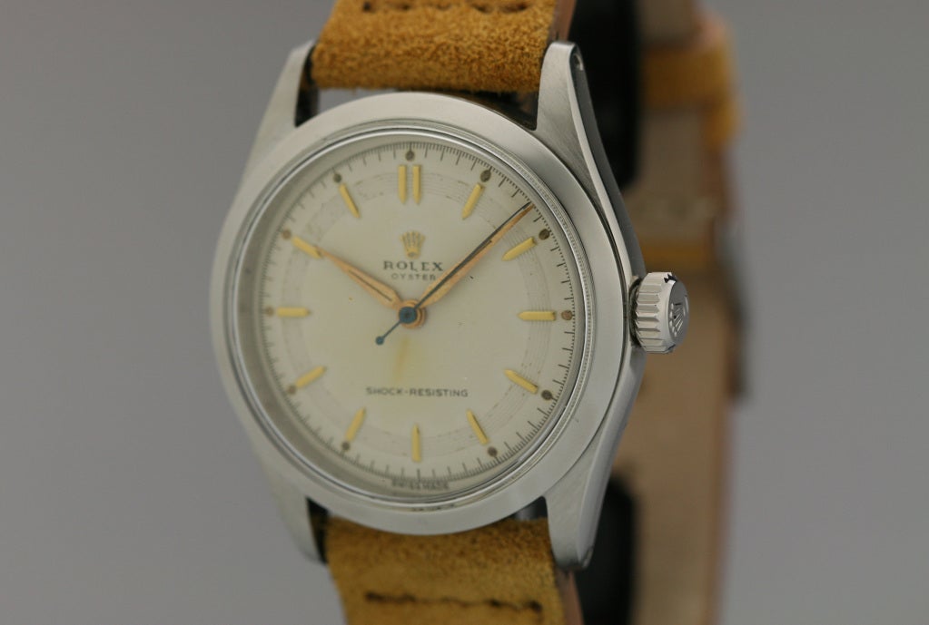 This is a beautiful Rolex Ref. 6282 that has an original ivory-colored dial with textured tracking and applied gold markers.