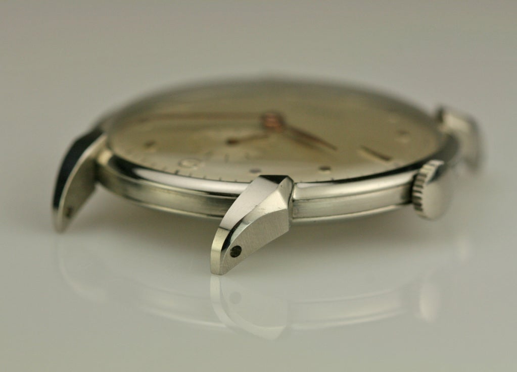 Lemania stainless steel wristwatch with beautiful dial and lugs, from the 1950s. Manual-wind 15-jewel movement.