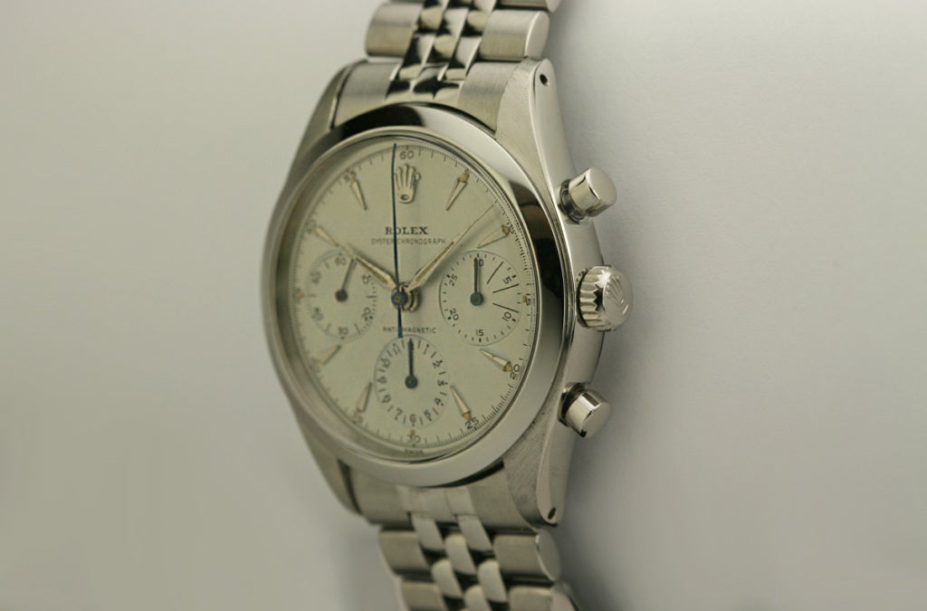 This is an exceptional and rare example of the Rolex chronograph, Ref. 6238, known as the Pre-Daytona. The original dial is a very rare variation with dagger makers and an underline above the hour chronograph register. This is a mint example with a