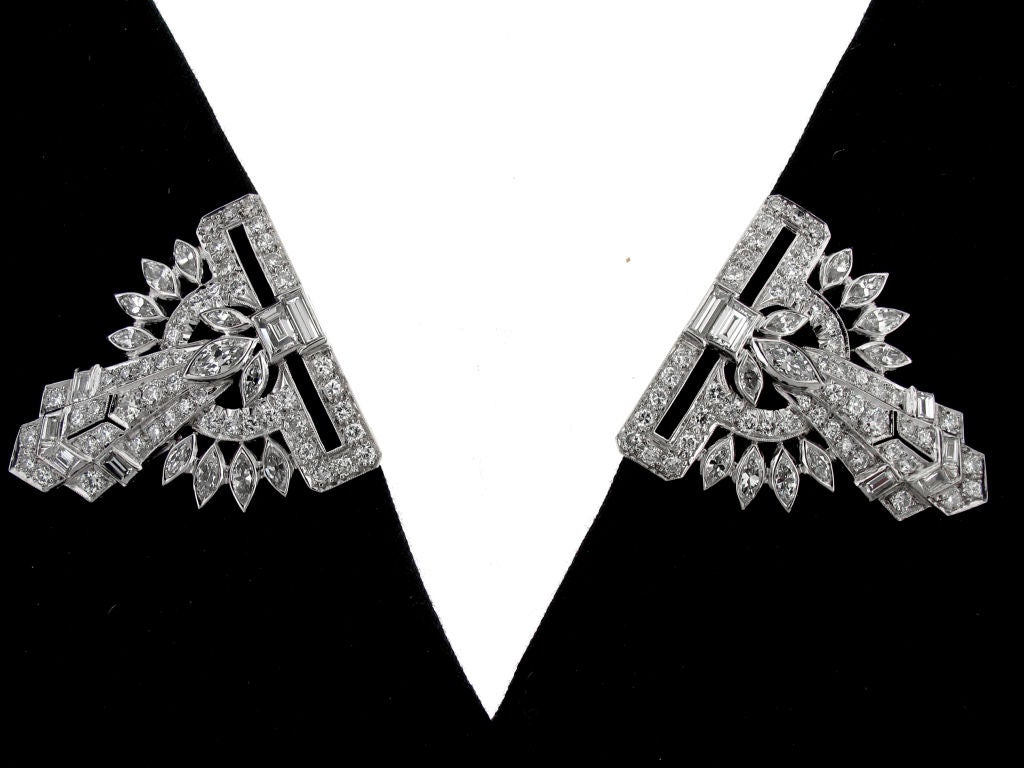 These dazzling Art Deco clips feature one hundred and thirty-four diamonds weighing 8.25 carats. Use these classic 1930s combination clips as a brooch or separate them and wear one on each opposing lapel or on opposite sides of a dress.