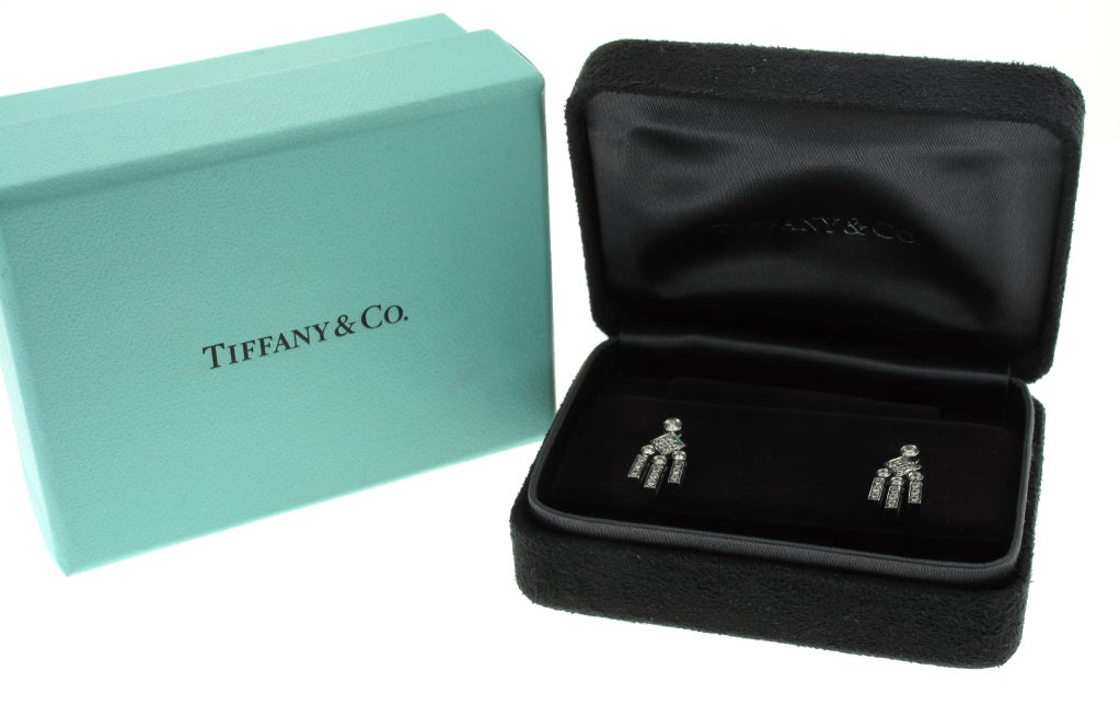 These beautiful Tiffany & Co. earrings are platinum and feature 34 diamonds with a total weight of .75 carats.  The diamonds are F color and VVS clarity.  The Earrings measure 5/8 of an inch in length.