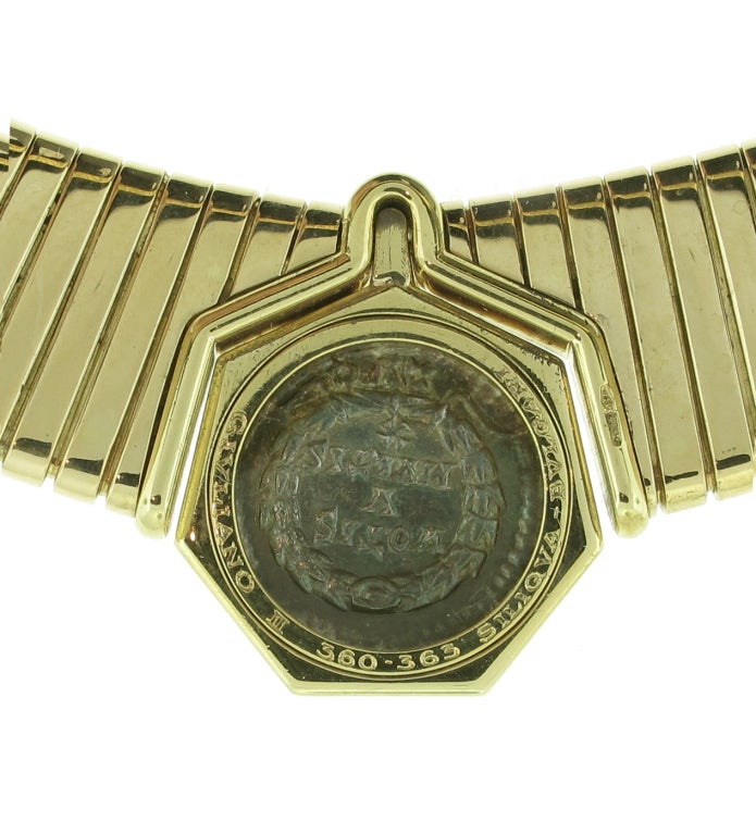 This Bulgari Tubogas necklace is truly one of a kind. The Siliqua coin - featured in the center of the 18 Karat yellow gold collar is a Roman silver coin from the 4th century and later. The collar is an average collar length and the design of the