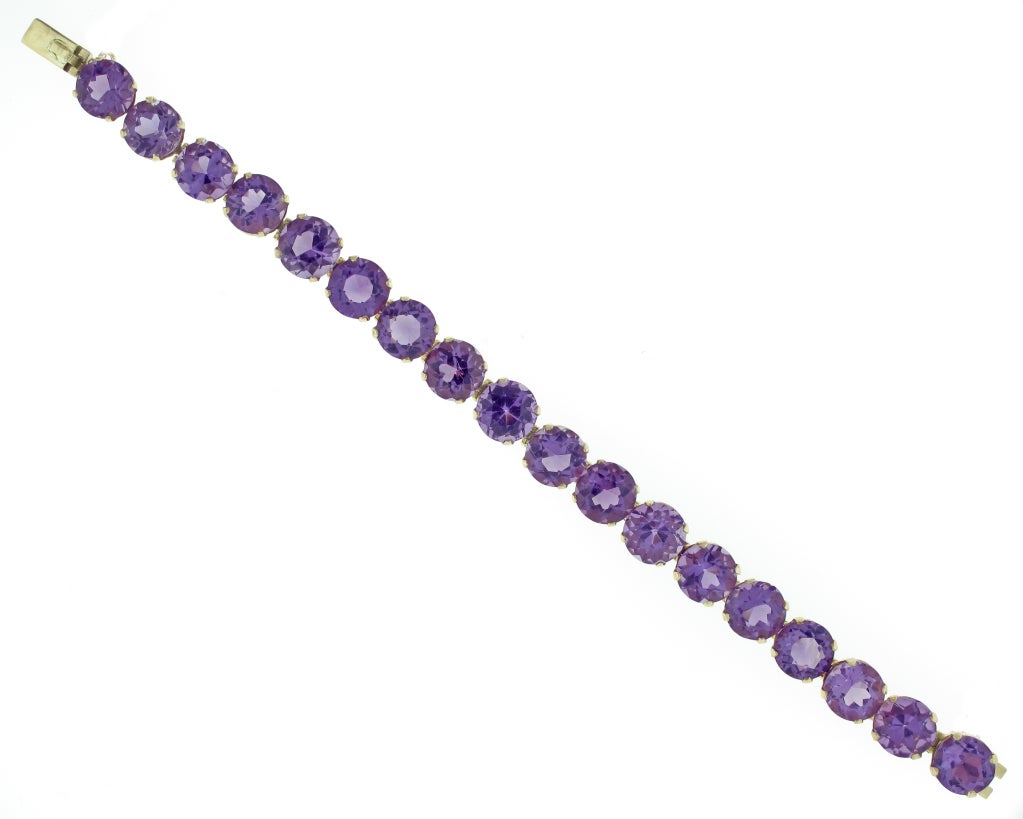 This one-of-a-kind amethyst bracelet is truly stunning.  17 round amethysts with a total carat weight of 58 carats are set in 14-karat yellow gold.  The bracelet measures 7.5 inches in length.
