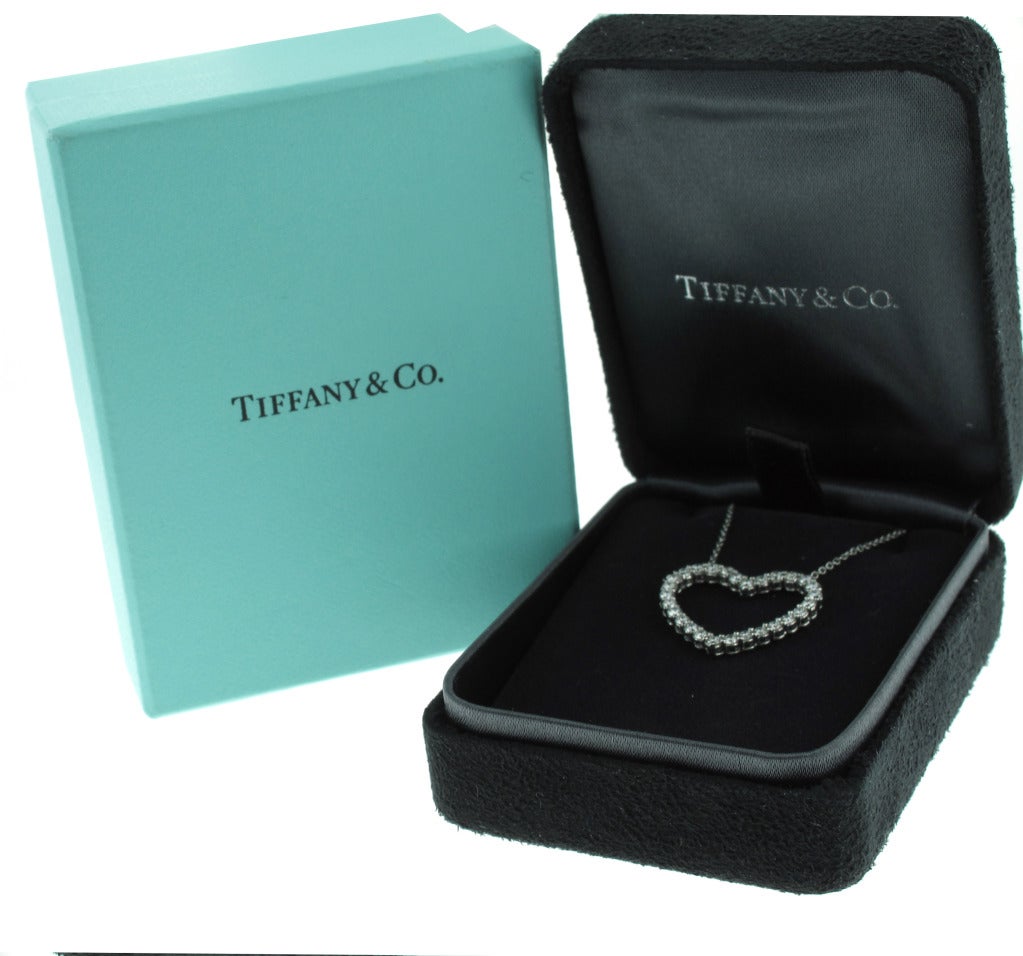 This stunning Tiffany & Co. diamond heart pendant is set in platinum and features .84 carats of round diamonds.  The chain measures 16 inches in length and open heart measures just under 1 inch in width and 1/2 of an inch in height.