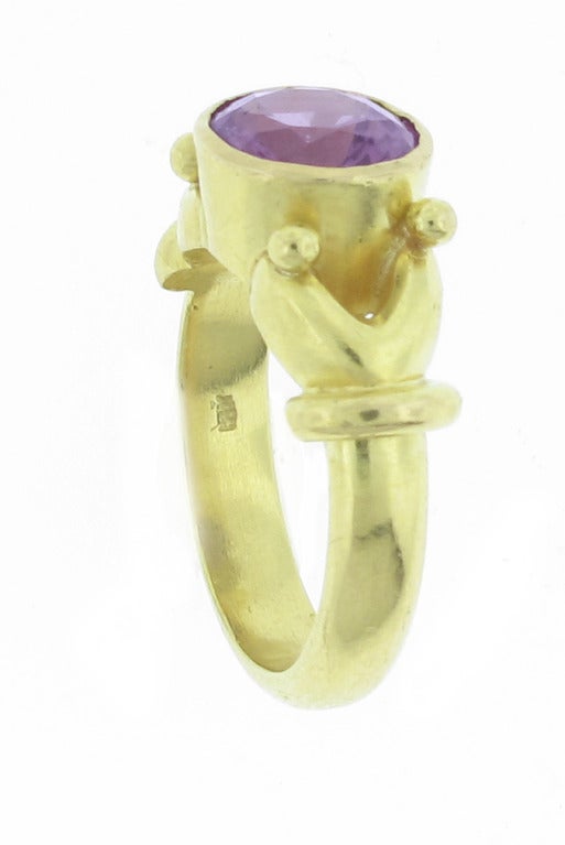 This 19 karat yellow gold Elizabeth Locke ring features a 3 carat purple spinel. The ring is a size 6 and is sizable.