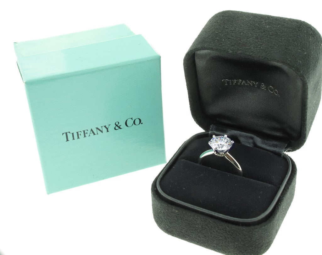 This Tiffany and Co. Diamond solitaire features a 2.28 carat round brilliant diamond. Color grade G, Clarity grade VS1 with a triple excellent cut grade.  This stunning diamond is in a classic 6 prong platinum setting.  The ring is a size 5.25 and