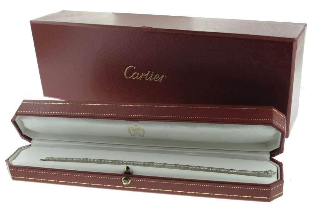 This beautiful Cartier diamond line bracelet is set in 18-karat white gold and features 59 diamonds with a total carat weight of 2.40. The bracelet measures 7 inches in length.