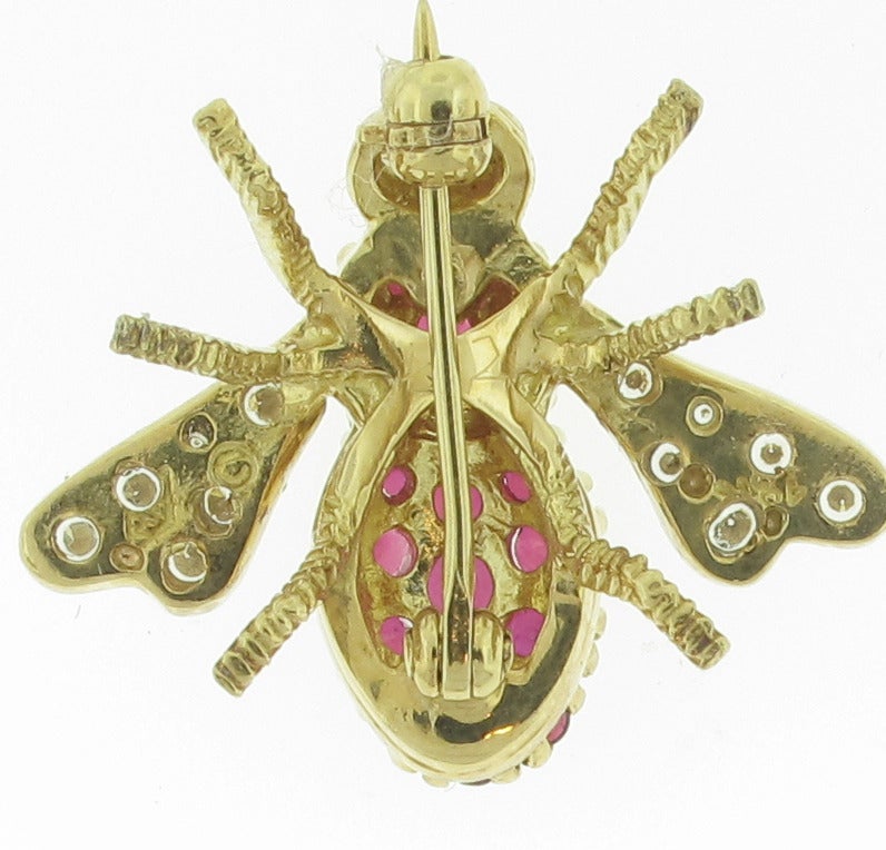 This beautiful Rosenthal bee brooch features 21 rubies with a total carat weight of 1.15 carats. These beautiful stones make up the body of the bee while the wings are covered in .33 carats of diamonds. The remainder of his body; his legs and head