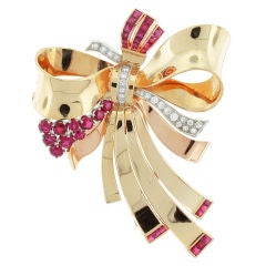 18-Karat yellow and pink gold ruby and diamond brooch 18-Karat yellow and pink gold ruby and diamond brooch