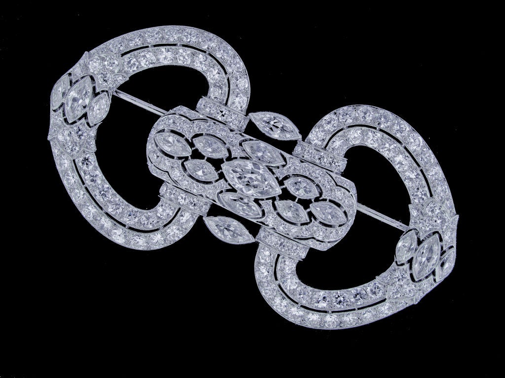 An elegant Art Deco diamond brooch lavishly embellished with over 11.5 carats of exceptional diamonds.  The broach was painstaking crafted using a minimal amount of platinum, a classic Parisian practice.  The result is a remarkably light and