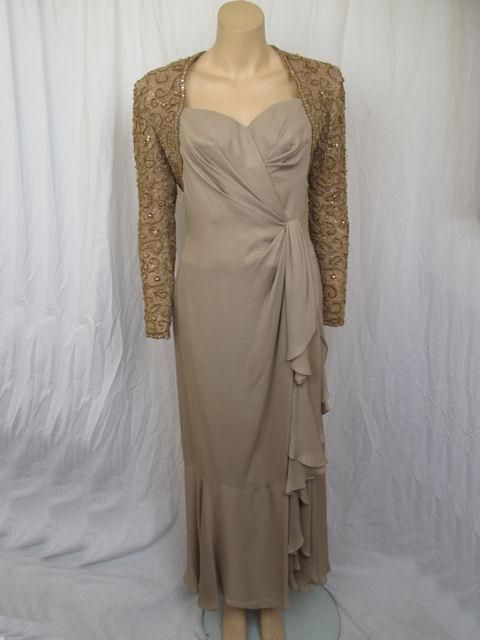 Description: A stunning faux wrap gown for an evening out.

* The attached bolero jacket is beautifully beaded with zippers on each sleeve.
* The bodice is lightly boned for a secure fit.
* It closes with a double zipper on the