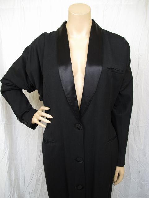 Here is this amazing Jean Paul Gaultier black long tuxedo jacket. Wear it over your favorite dress or with your favorite pair of pants.

* It has a black satin shawl collar with three buttons down the front & three functioning buttons at the