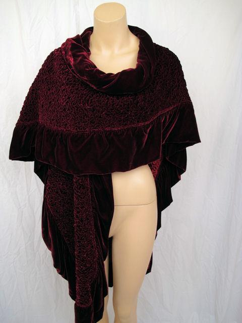 This beautiful wrap has a puckered design with a ruffled edging.  The color is a deep burgundy & the inside is a bright red contrast.  The perfect wrap for an evening out.

Measurements:

Width: 38