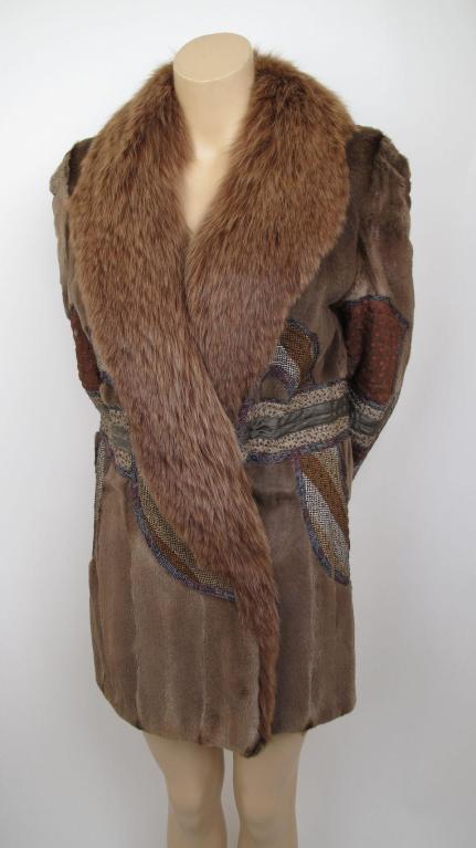 Here is this amazing coat by Koos Van Den Akker for Ben Kahn.

* The collar is made of brown fox & the body is sheared mink.
* It has patchwork throughout the body & sleeves.
* It has two pockets on the outside & one interior pocket.
* Please