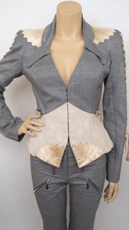 Here is a stunning Christian Dior 2pc black & white plaid pantsuit.

* The jacket has a gathered collar & closes with hook & eyes.
* The jacket has ivory ribbon detail down each sleeve & around the waist to the back.
* The pants have several