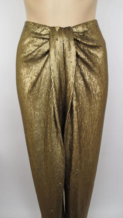 Here are these amazing Donna Karan gold sequins harem pants.

* What makes these pants so cool is the fact they do not have an outside side seam.
* They have an elastic waistband & close with a zipper down the back.
* The size tag is missing so