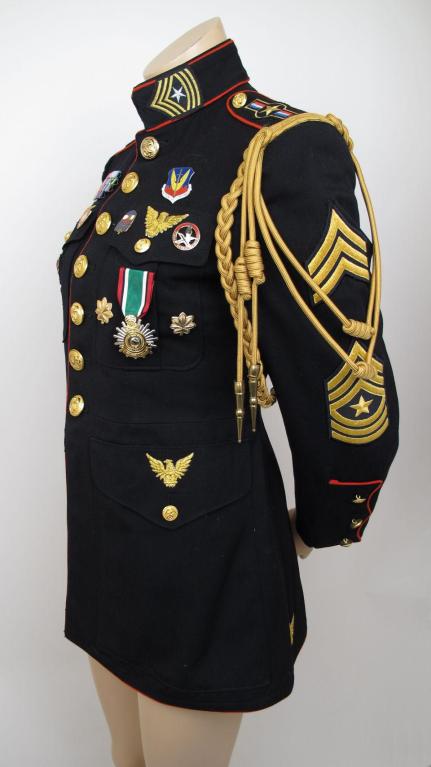 Here is a fabulous, vintage military jacket representing all arms of the military.

* It has red piping & four patch flap pockets with gold tone eagle buttons on them & throughout the jacket.

Measurements
Sleeves 24
Shoulders 16
Chest