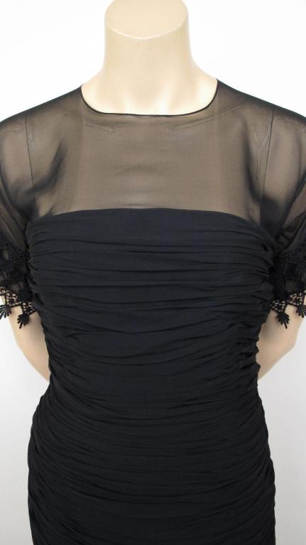 Such a pretty cocktail dress by Miss O by Oscar de la Renta.

* The bodice is made of black chiffon that's attached to a form fitting ruched body.
* The sleeves & hem line is beautifully detailed in black lace. * It's fully lined & closes with a