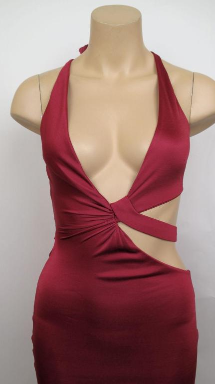 Here is this 100% authentic Tom Ford for Gucci form-fitting cut-out halter dress.

* It's marked a size extra small but please refer to the measurements provided for an accurate fit.

Measurements:

Sleeves NA
Shoulders NA
Chest 34
Waist