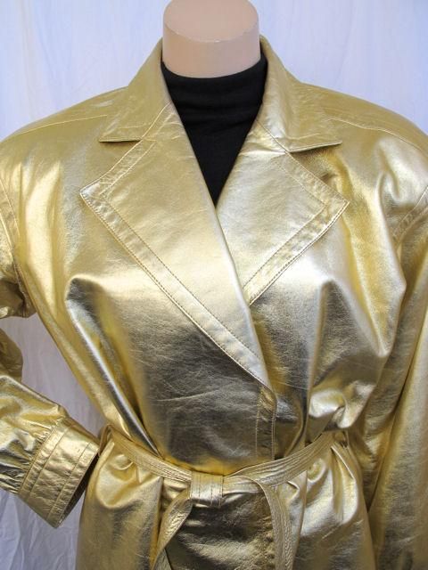 Here is the stunning Yves Saint Laurent jacket.

* It's made of gold leather with a belt & an unattached belt.
* It's fully lined & in excellent condition.
* It's marked a size 38 but please refer to the measurements provided for an accurate