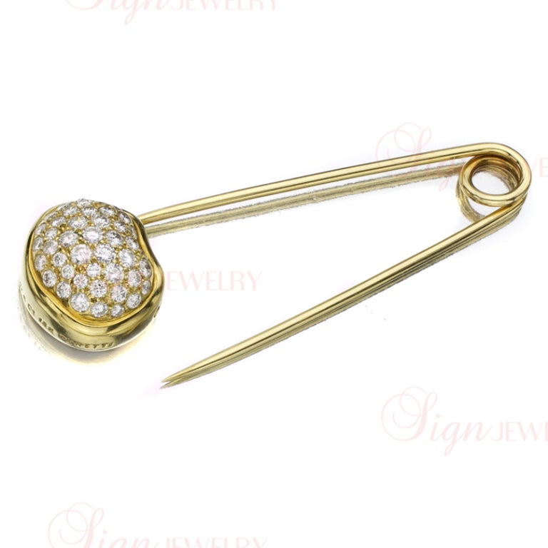 A beautiful and elegant brooch designed by Elsa Peretti for Tiffany & Co. Made in 18k yellow gold in the shape of a safety pin and pave-set with approximately 1.80 - 2.00 carats of round brilliant diamonds. 
GRAM WEIGHT: 8
DIAMOND COLOR: