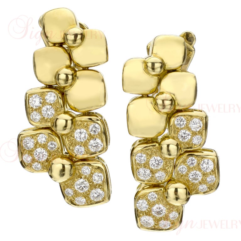 Unsurpassed quality and superior craftsmanship, this authentic Van Cleef and Arpels jewelry set features a handsome and classic bow-shaped design with stunning natural round brilliant diamonds pave-set in smooth 18k yellow gold. There is an