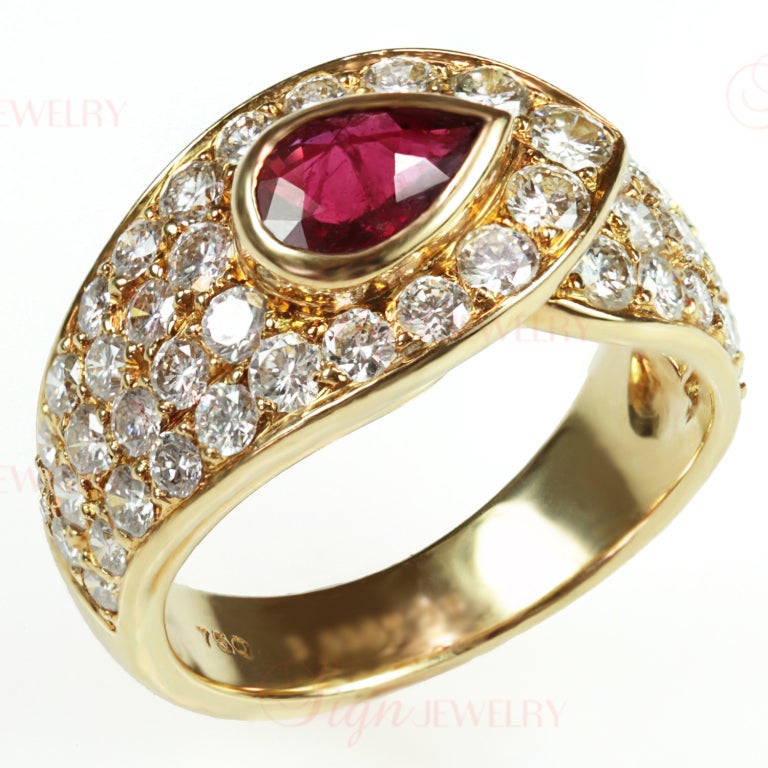 An authentic circa 1990s women's ring from Van Cleef & Arpels. This radiant band is made in 18k yellow gold and bezel-set with a beautiful pear-shaped ruby of approximately 0.85 carats. The faceted 4.0mm x 6.0mm ruby is bright, clean and deep red in