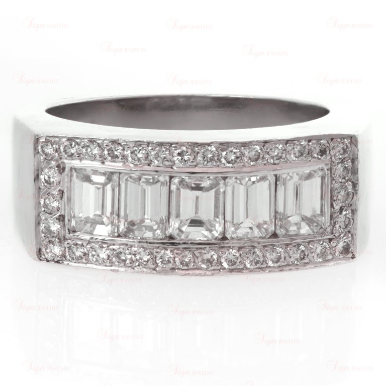 This fantastic men's band is made in fine platinum and features a rectangular face channel-set with 5 emerald-cut diamonds with an estimated 2 carats, and surrounded by an estimated 0.85 carats of round pave-set diamonds.
9mm Width - 47mm