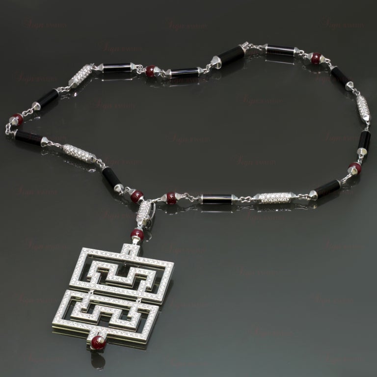Inspired by Chinese culture and Art Deco style, this magnificent necklace from Cartier's Le Baiser Du Dragon collection is made in 18k white gold and features cabochon ruby beads with cylindrical links of black onyx and round diamonds. Completed by