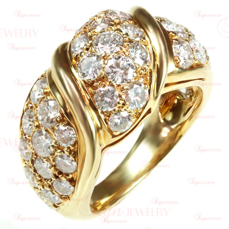 This authentic Van Cleef & Arpels women's ring is made in 18k yellow gold and features am estimated 2.40 carats of sparkling round diamonds. Circa 1990s. A radiant design.
11mm Width.
Ring Size 4 - EU 46. Resizable - $35 for each size up and