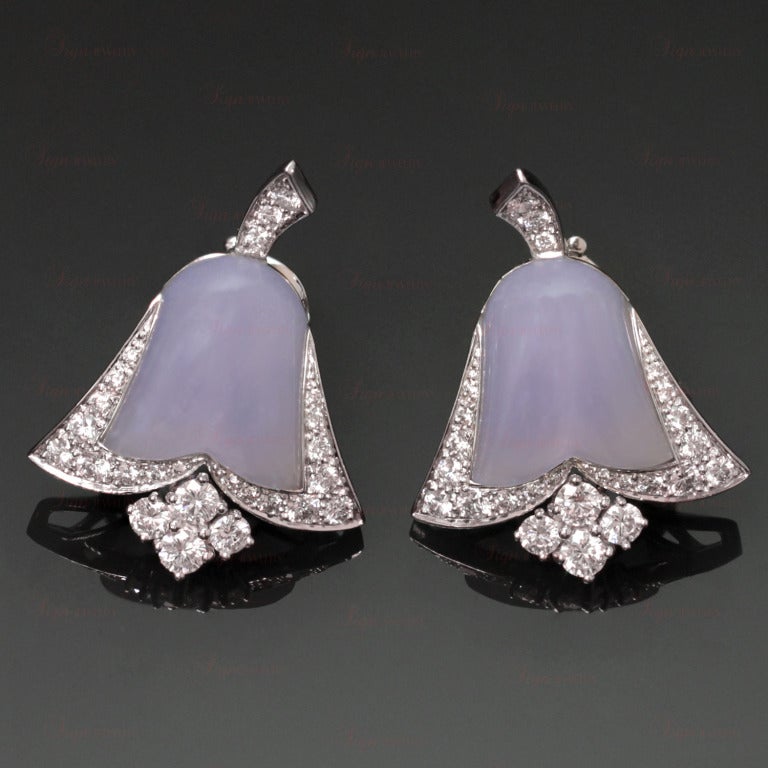 These exquisite and iconic Van Cleef & Arpels earrings are modeled after bluebell flowers. Made in 18k white gold and composed of central polished chalcedony stones and brilliant-cut pave-set diamond borders with stem and stamen highlights. Posts