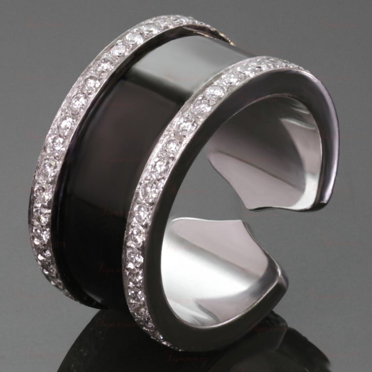 This fabulous open band Cartier ring is made in 18k white gold, black lacquer, and sparkling round diamonds of an estimated 0.90 carats. One of the most iconic signs of Cartier - the Double C logo. Perfect every day elegance. Circa 2000. Ring size