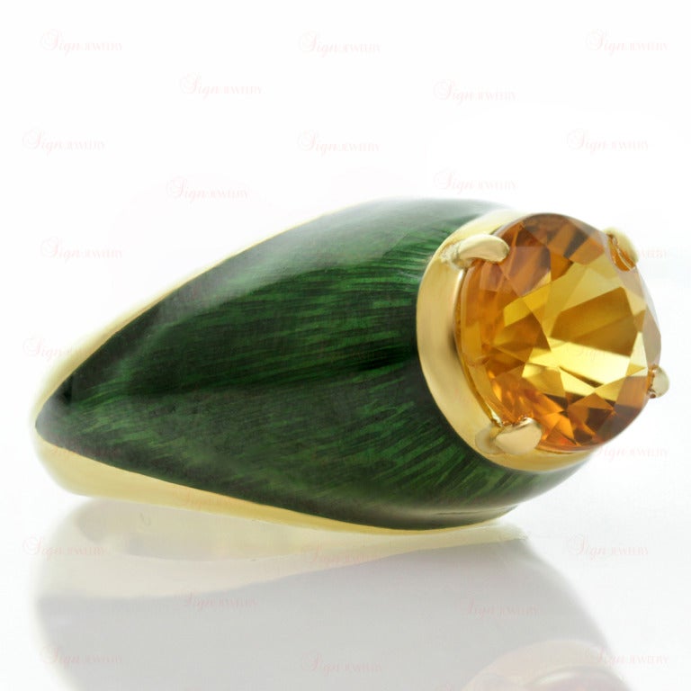 This rare Boris Le Beau dome-shaped cocktail ring features a 9.0mm faceted round orange citrine stone of an estimated 3 carats, prong-set in 18k yellow gold and surrounded radiant green enamel inlays. Circa 1970s. Chic and fabulous. Ring size is 5.5