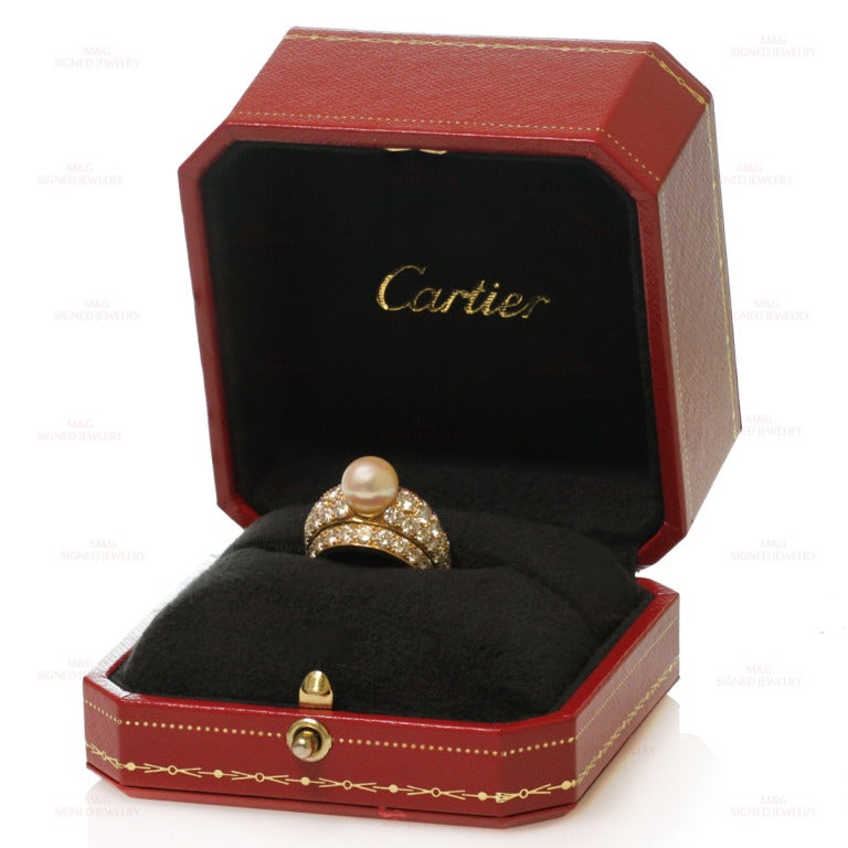 This rare and fabulous dome band is a timeless 1980s classic from Cartier London. The ring is made in 18k yellow gold and features a cultured 8.0mm pearl accented by five rows of brilliant-cut E-F VVS1-VVS2 diamonds of an estimated 5 carats. Marked