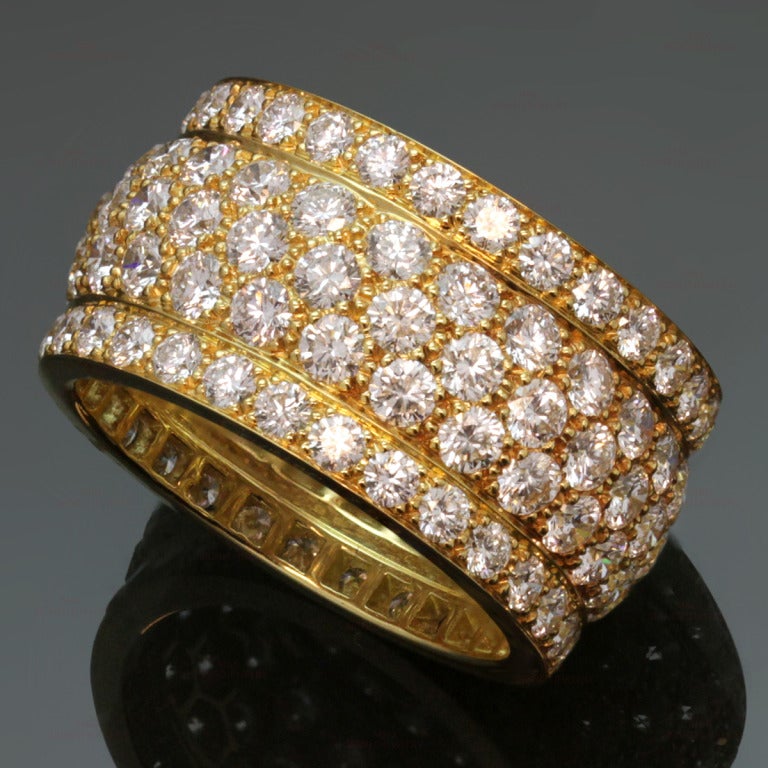 This stunning band from Cartier's Nigeria collection is crafted in 18k yellow gold and features 5 rows of sparkling brilliant-cut round diamonds of an estimated 5.50 carats. Iconic and timeless. Non-resizable. Ring size is 7.5 - EU 56.  Estimated