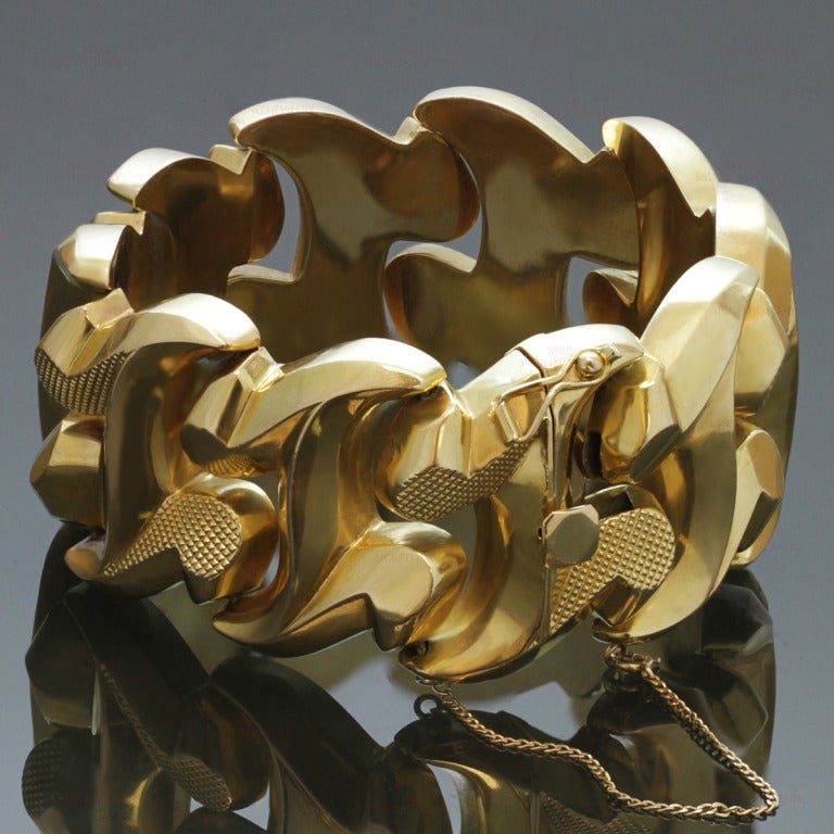 This fabulous circa 1940 bracelet from Genoa, Italy features chic geometric multi-textured links made in 18kt yellow gold and completed with a safety chain. Makers mark 