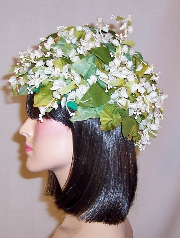 This is a delightful and whimsical Lily of the Valley chapeaux by Bohan for Dior.  The flower was Christian Dior's personal favorite and he used it in prints, embroideries and as the basis for the perfume Diorissima. The circumference measures 22