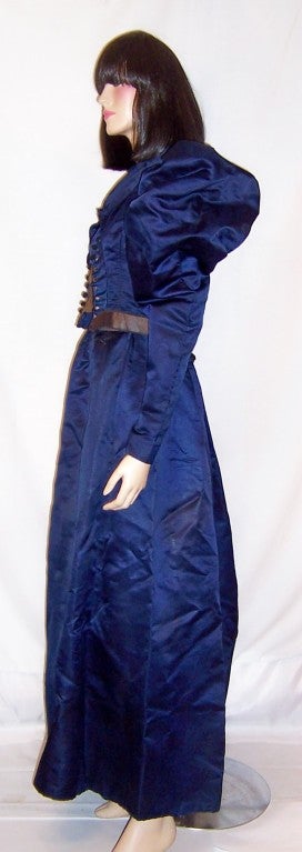 This is an exquiste Victorian vivid navy silk fitted bodice and matching full length skirt of the late 19th century.  The outfit exhibits many couture design elements.  The bodice is beautifully cut and tailored with fifteen black crocheted covered